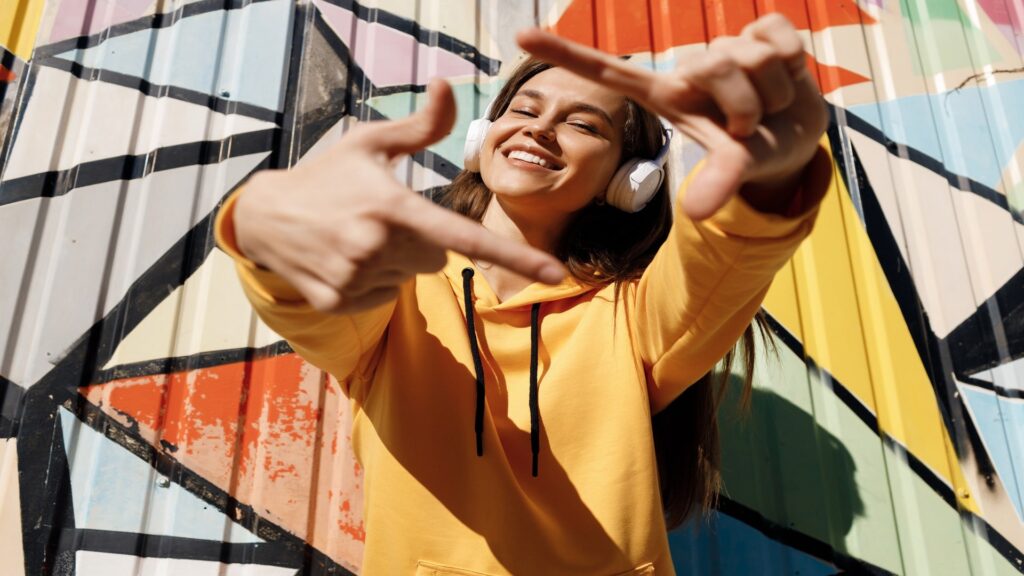 Woman dancing with headphones, funk energy